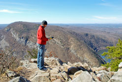 Man surveying rocky trail.